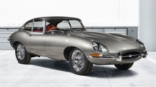 Image of silver classic Jaguar E Type car in showroom