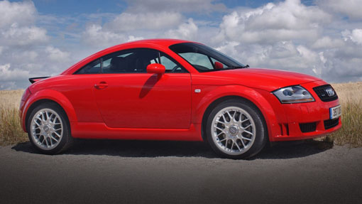 Image of red Audi TT car parked on a rural road