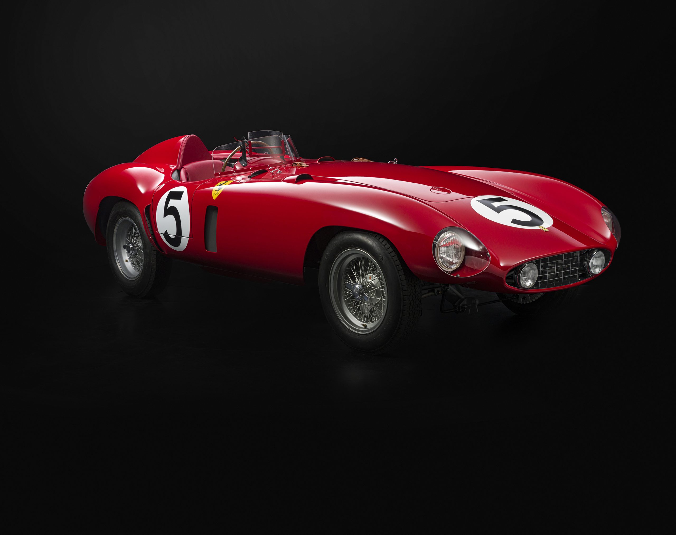 Image of classic red Ferrari on a black background
