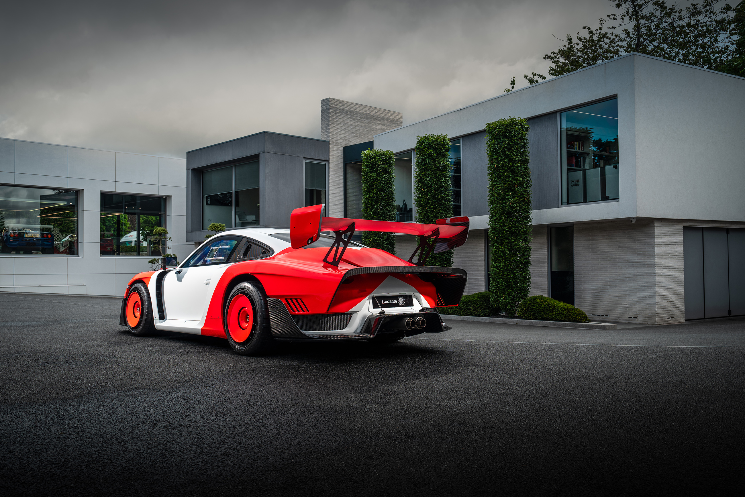 Two road-going Porsche 935s on display with Lanzante at the