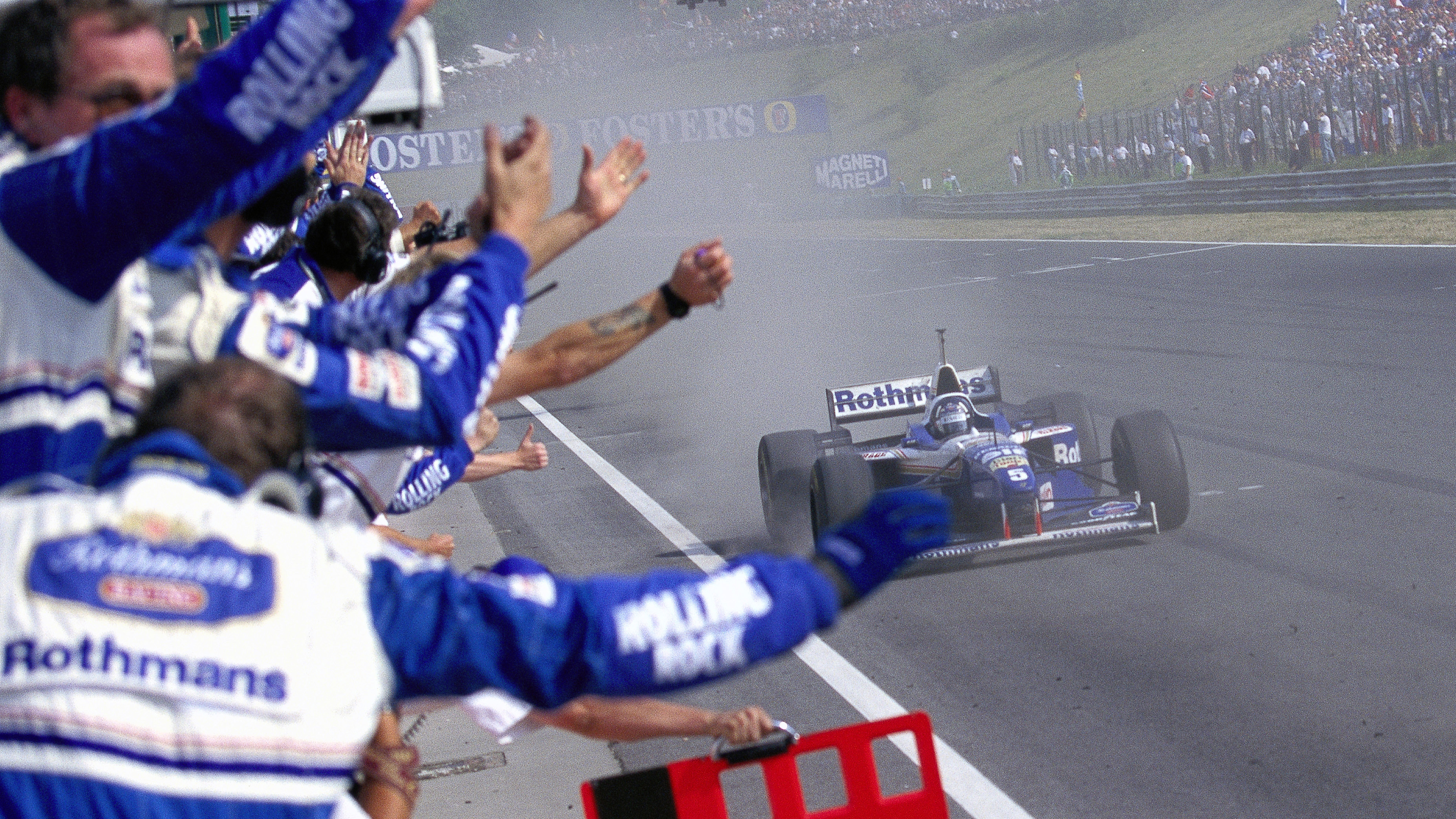 Damon Hill crosses the line in second position as Williams celebrate a double podium at the 1996 Hungarian GP.