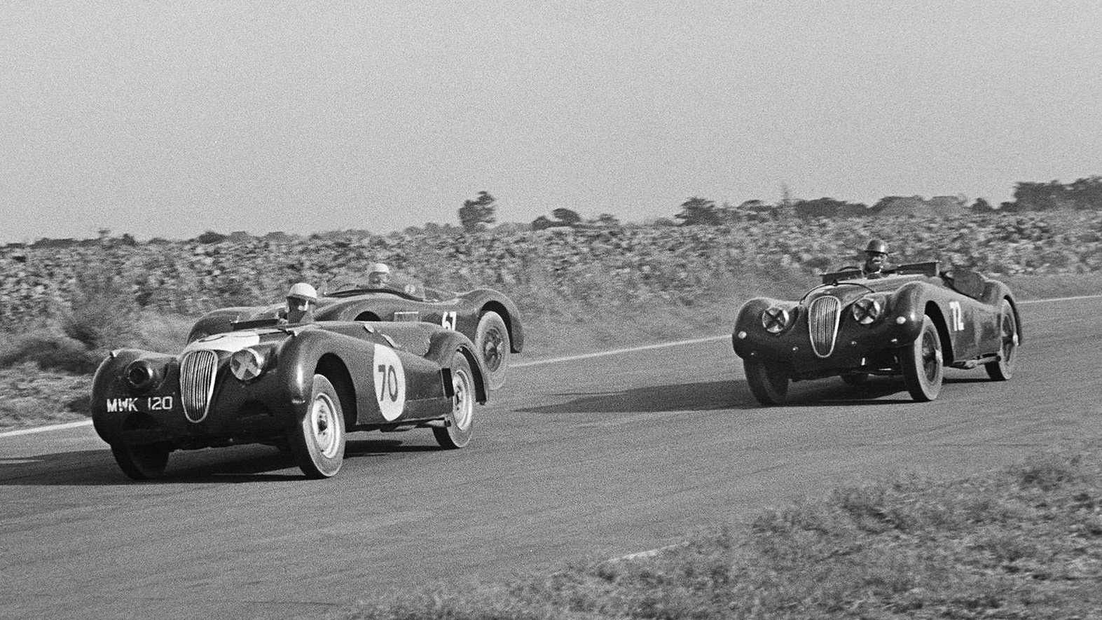 Protheroe races his #72 Jaguar XK120 at Goodwood in September 1954.