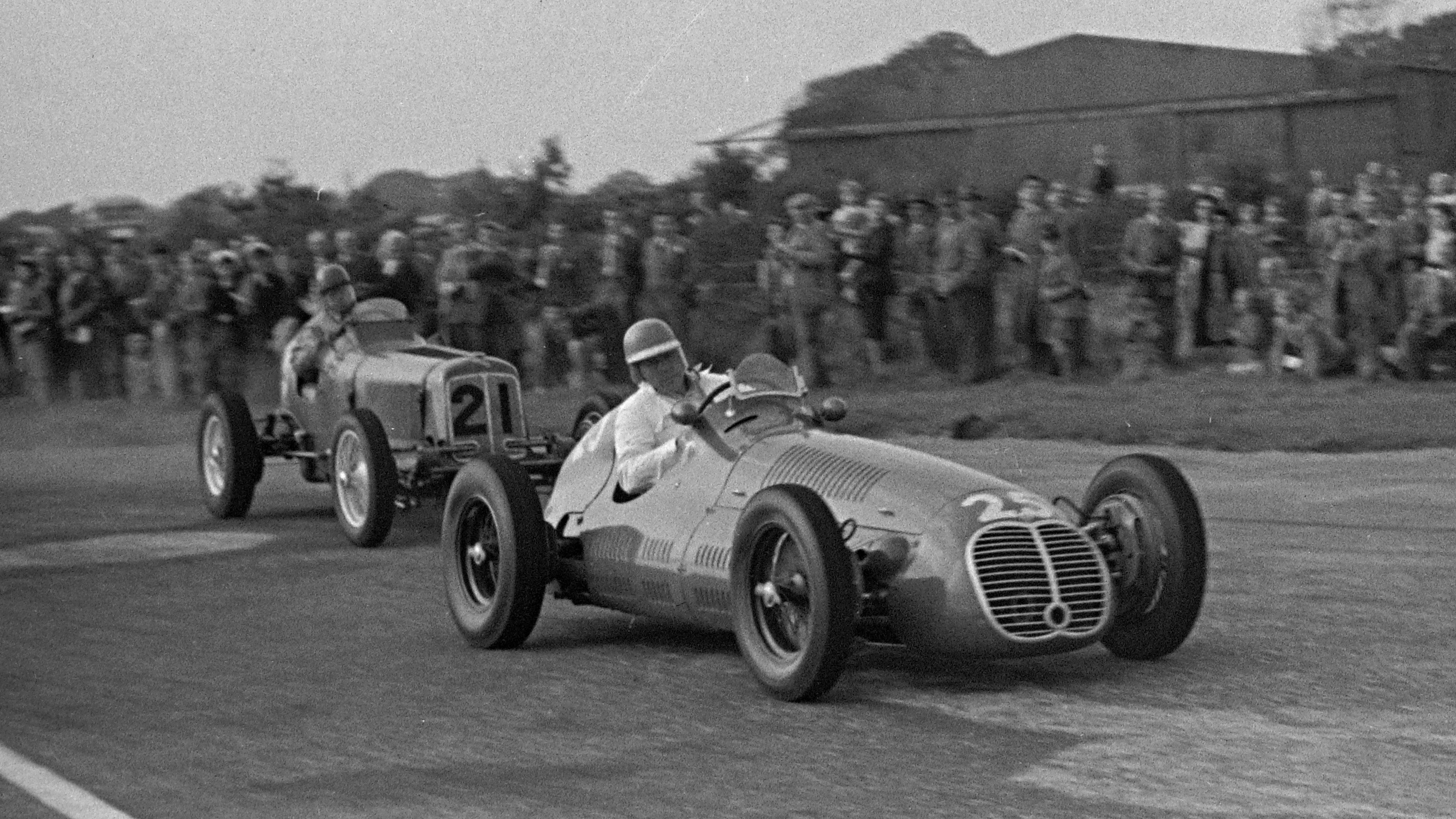 Bob Gerard's ERA B chases the Maserati 4CLT/48 of Reg Parnell in the 1948 Goodwood Trophy.