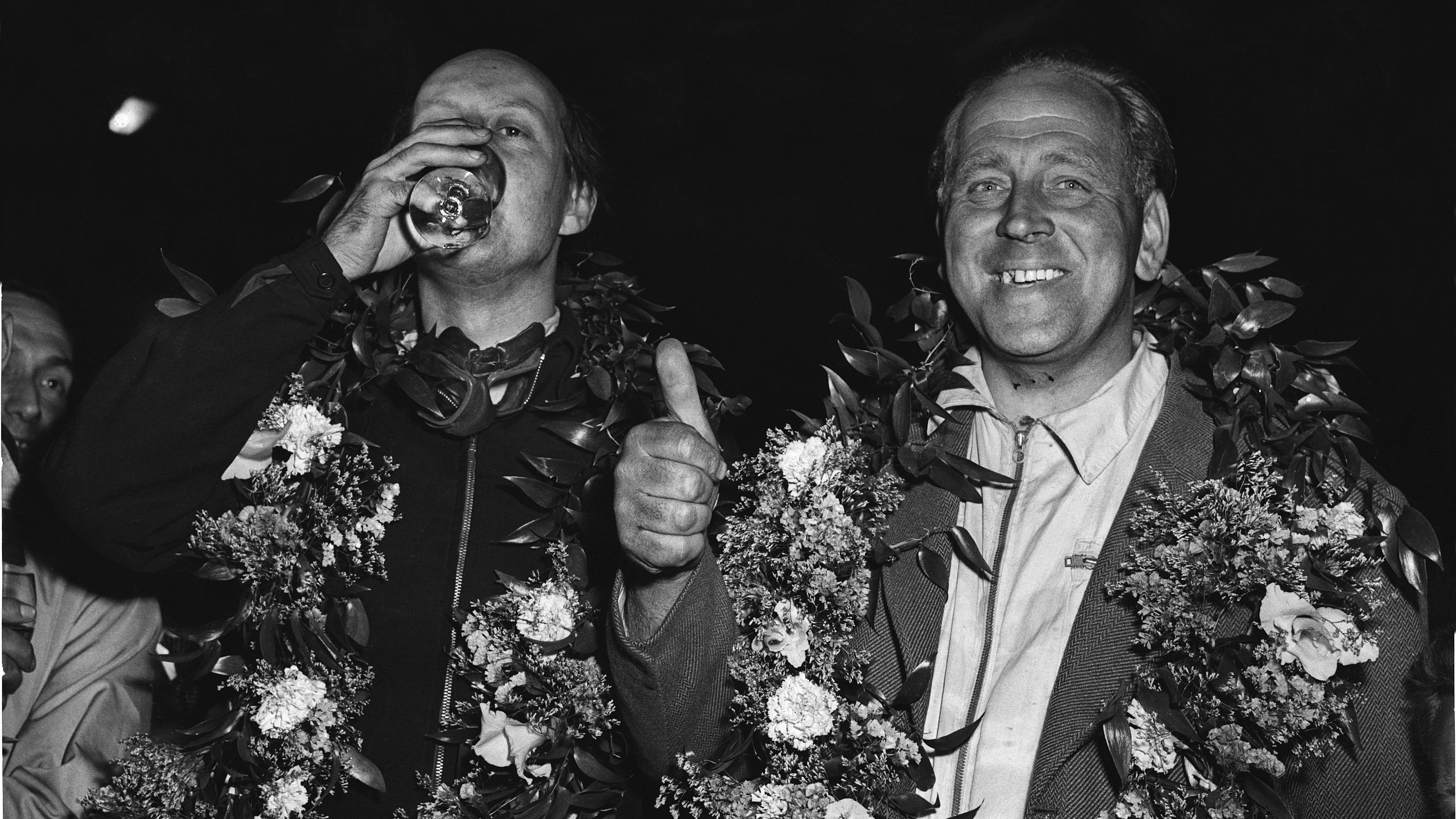 Reg Parnell and Eric Thompson celebrate after guiding their Aston Martin DB3S to victory at the 1953 Goodwood 9 Hours.