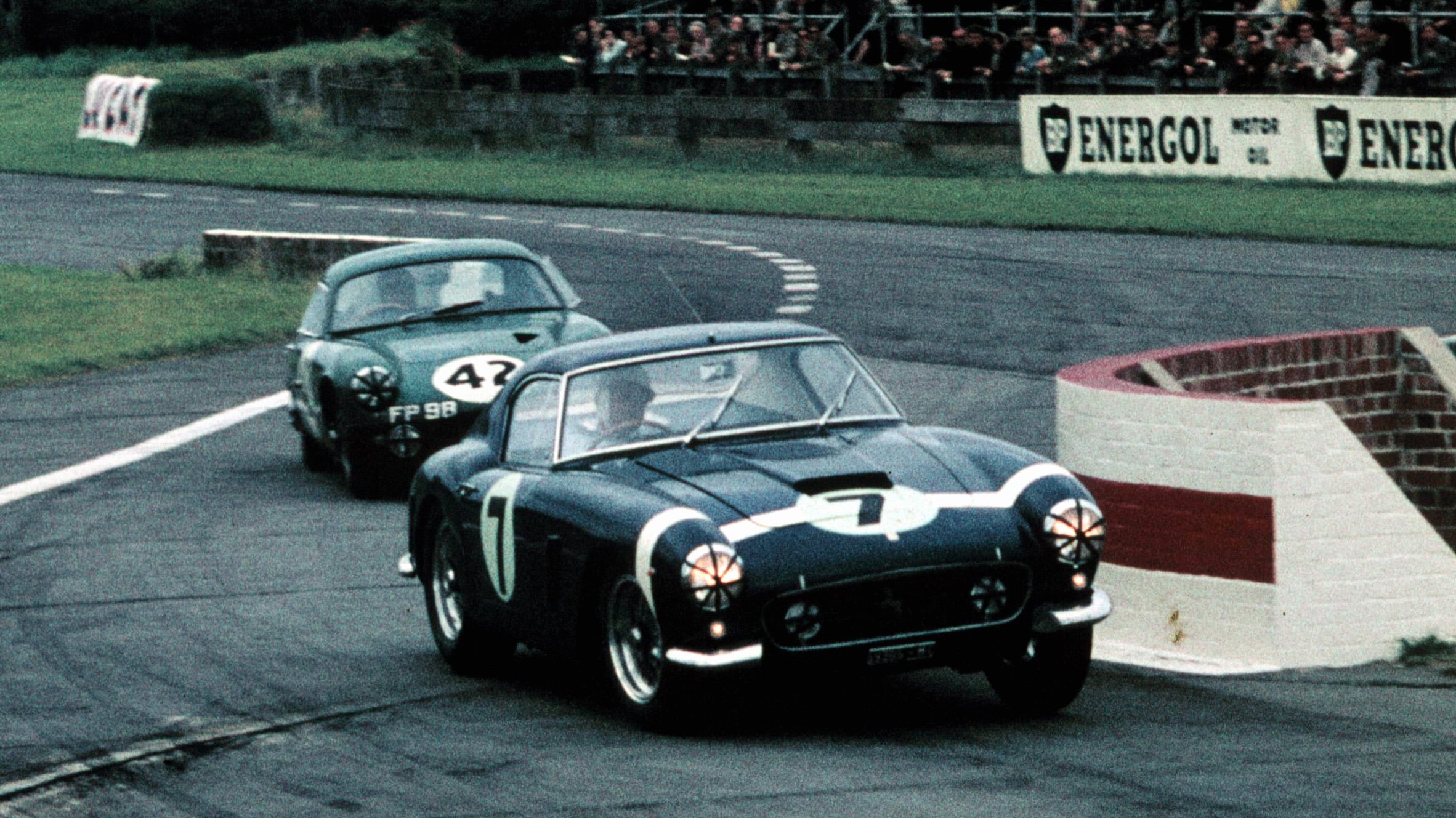 Moss’ Ferrari 250GT leads the Lotus Elite of John Wagstaff and Tony Marsh, on his way to a third RAC TT victory at Goodwood, August 1960.