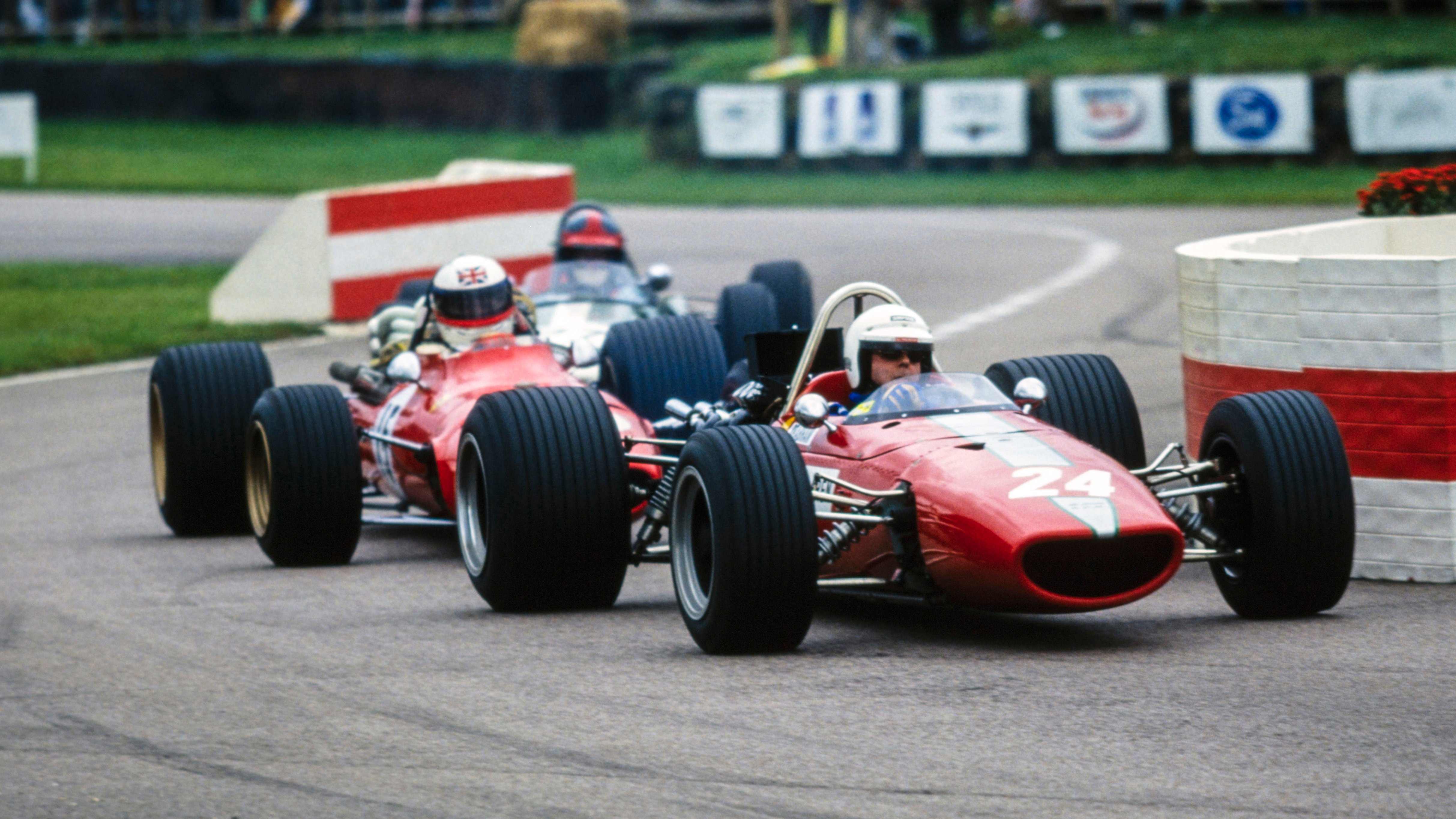 Brabham’s McLaren M5A BRM leads the Ferrari 312 of Derek Bell during the Glover Trophy at the Goodwood Revival, September 1999.