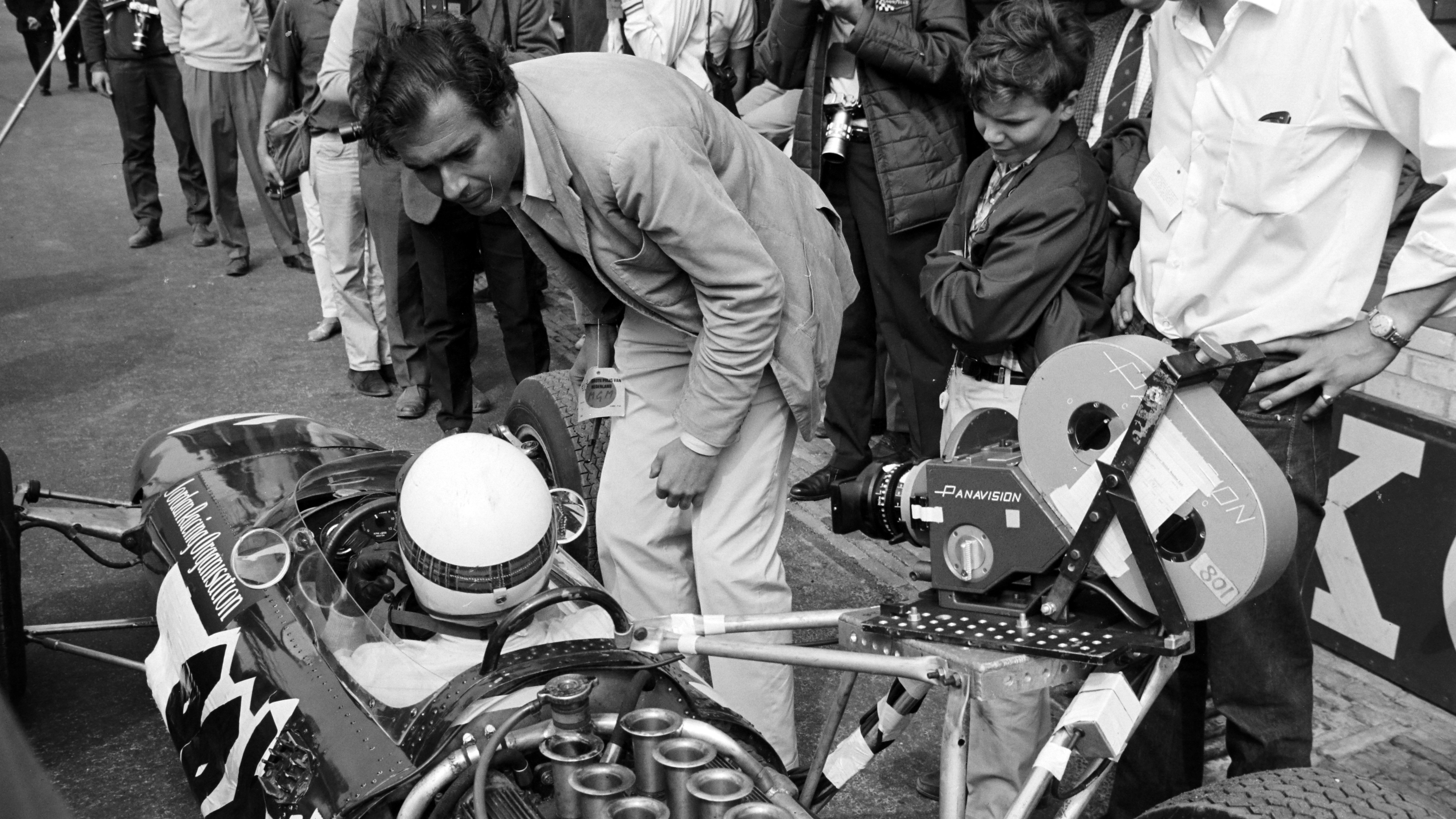 'Grand Prix' director John Frankenheimer talks with Phil Hill at the 1966 Dutch Grand Prix.