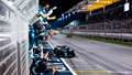 The Aston Martin team celebrates as Fernando Alonso finishes third at the 2023  Bahrain Grand Prix.