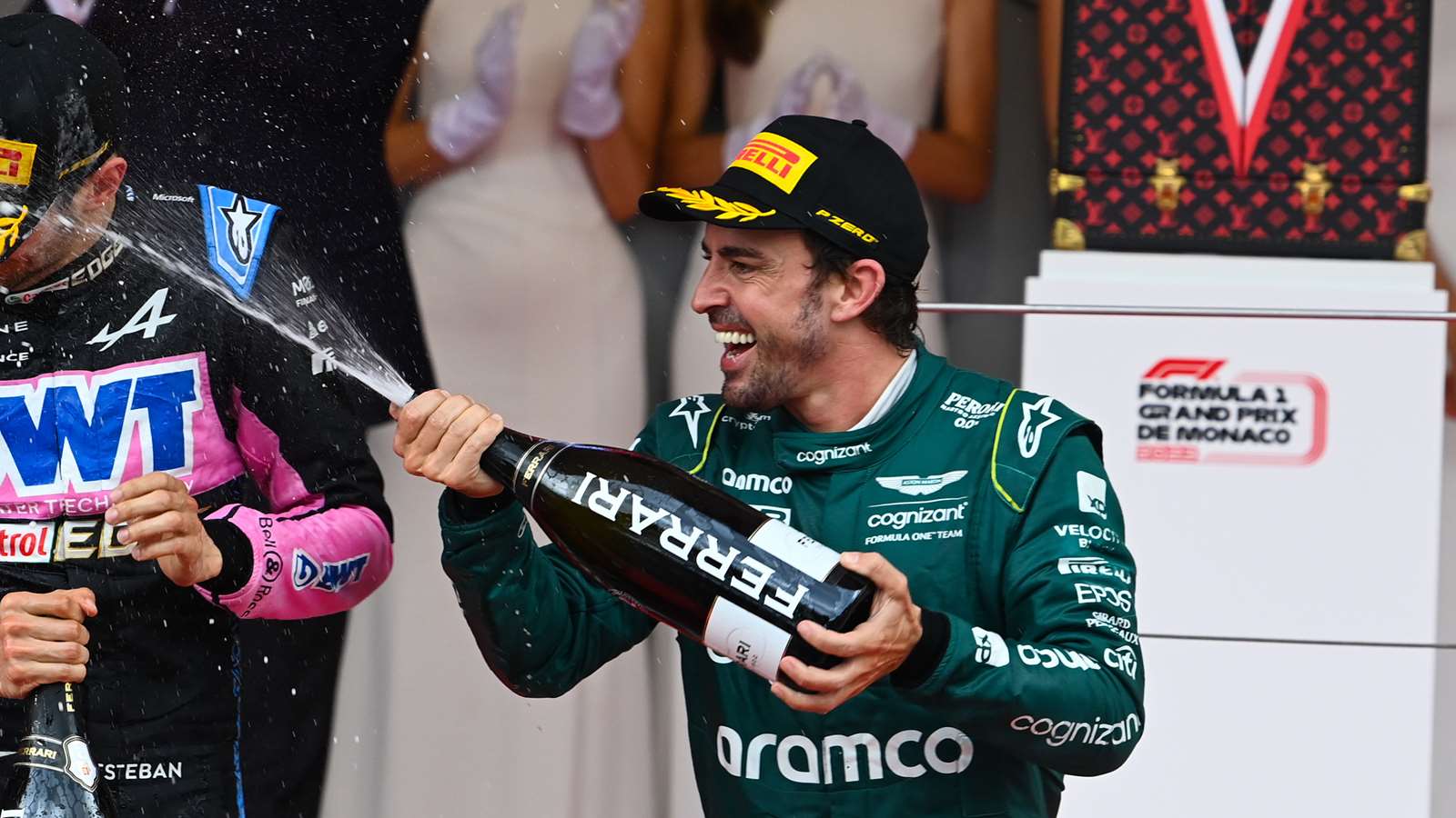Fernando Alonso celebrates on the podium at the 2023 Monaco Grand Prix.