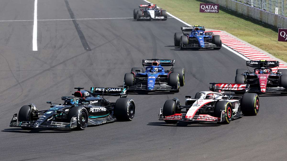George Russell battles Kevin Magnussen at the 2023 Hungarian Grand Prix.