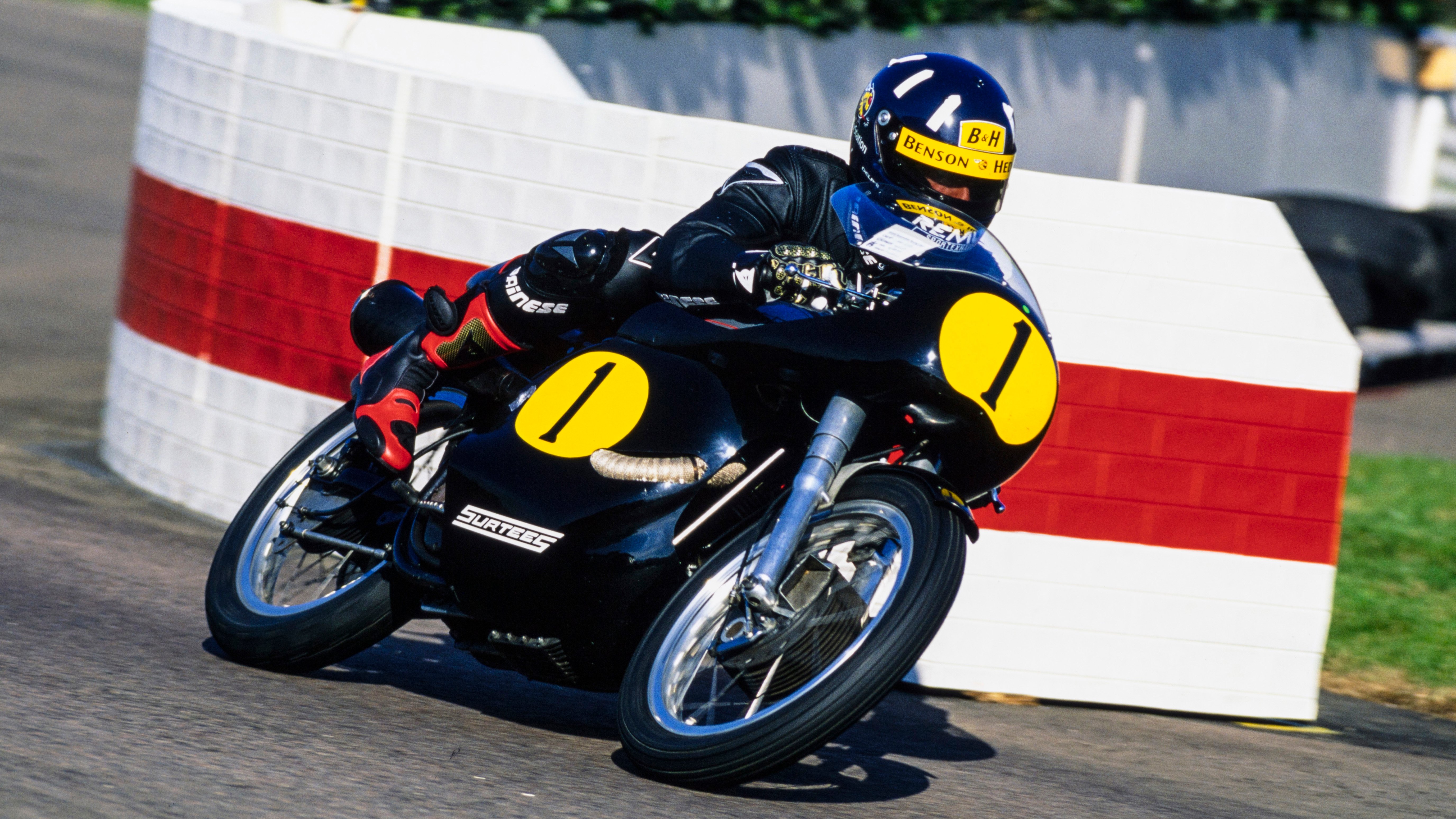 Primarily a lover of motorbikes, Hill raced a Manx Norton in the Lennox Cup at the 1998 Goodwood Revival.