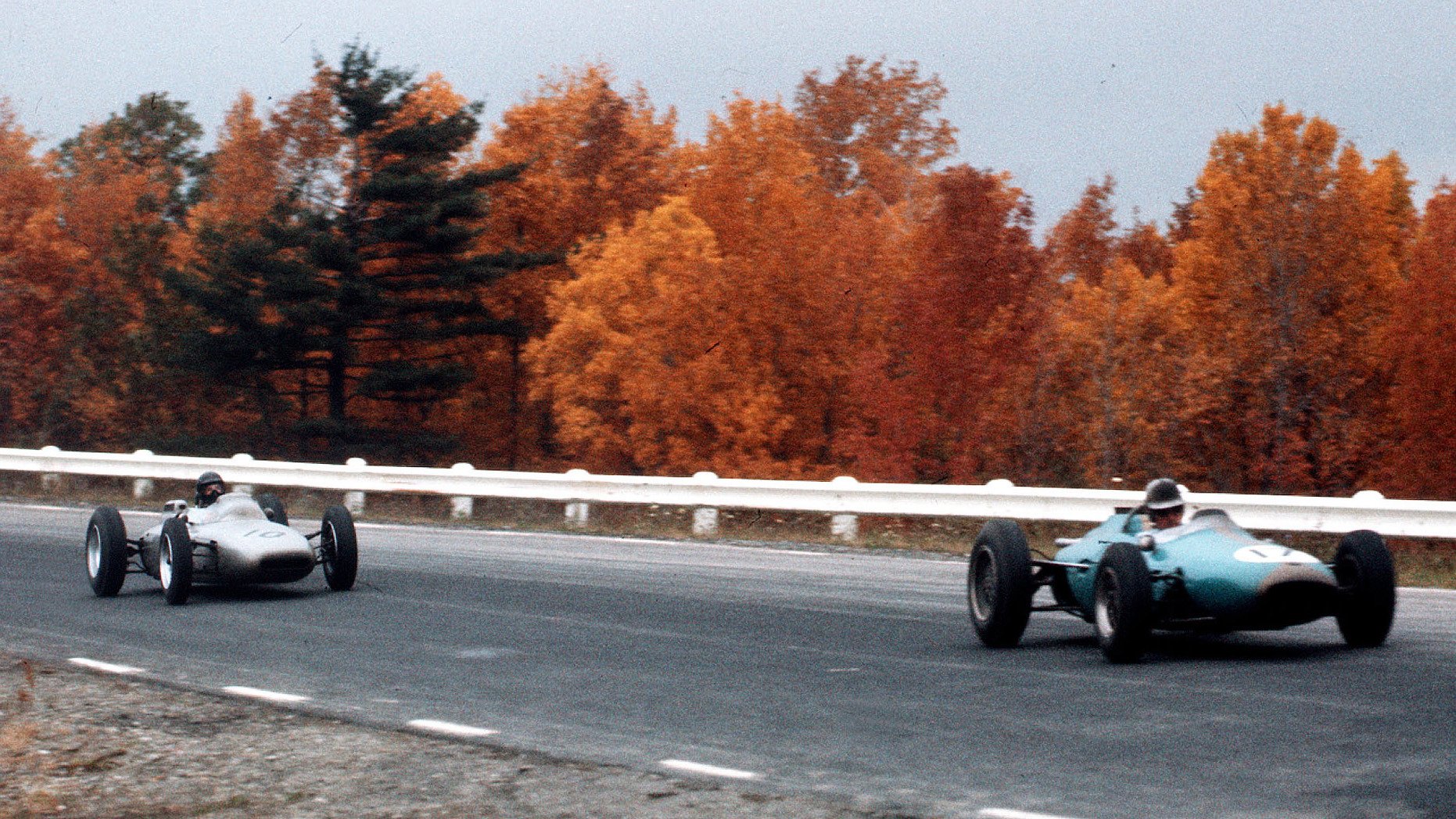 Jack Brabham, driving his Brabham BT3, leads the Porsche 804 of Dan Gurney during the 1962 United States Grand Prix at Watkins Glen.