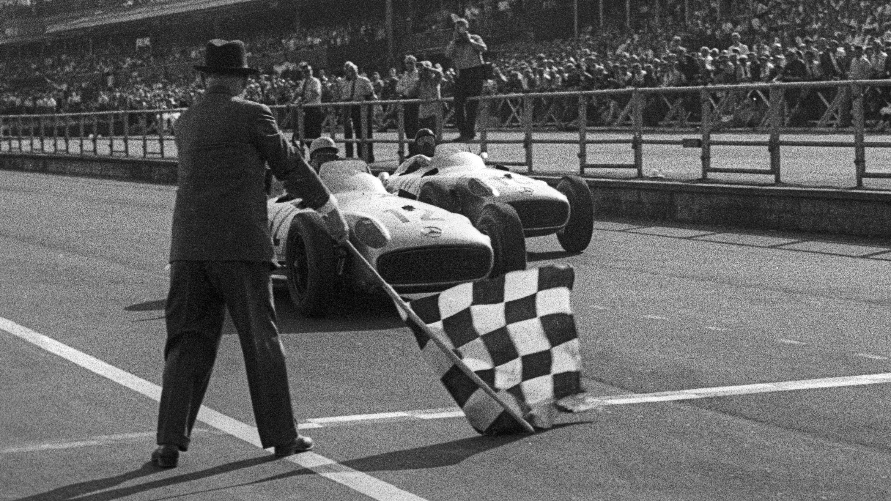 Moss takes a narrow victory over Fangio at the 1955 British Grand Prix.