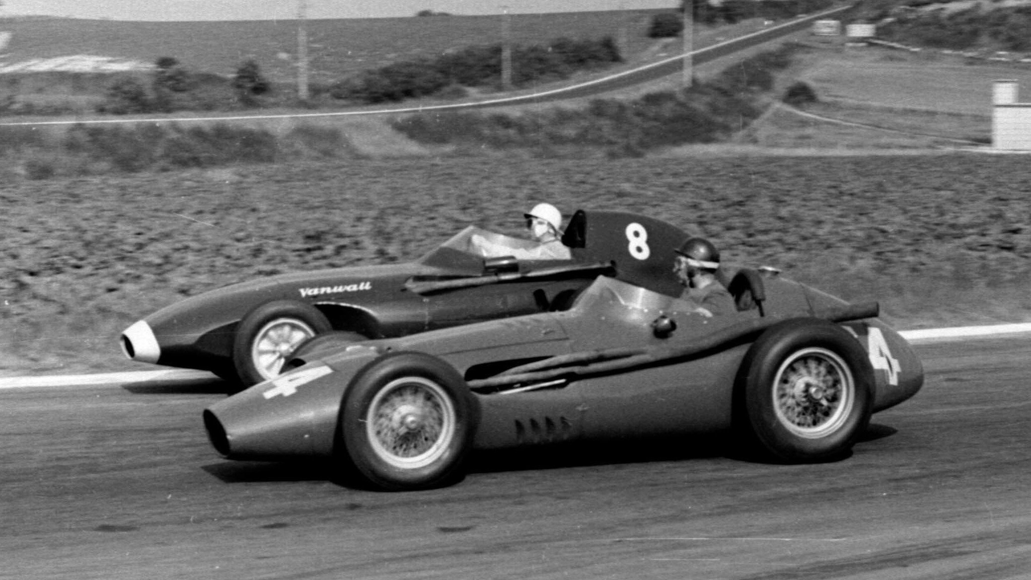 The Vanwall of Moss and the Maserati of Fangio battle it out at the 1958 French Grand Prix, Fangio's final race.