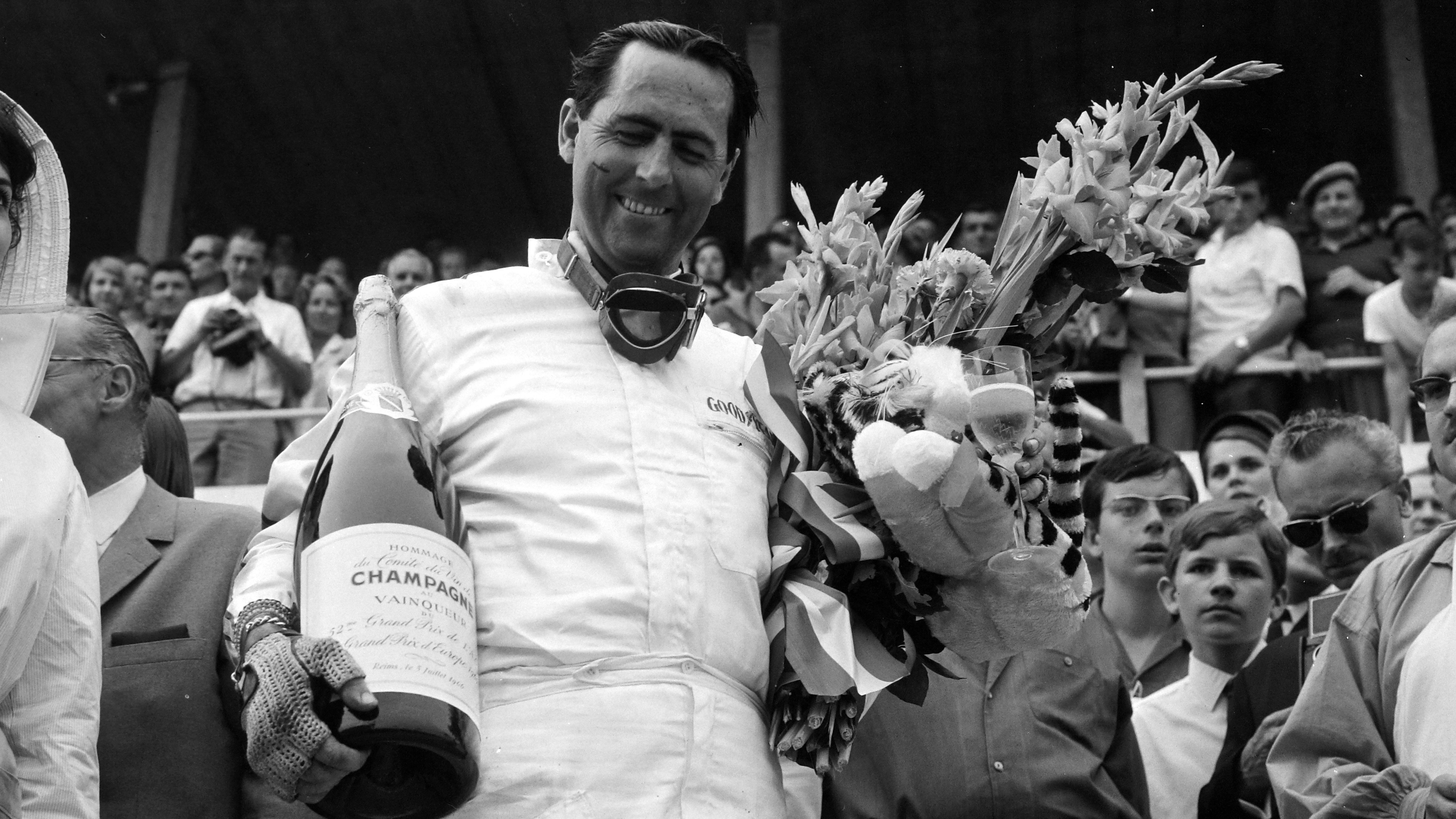 Winner Jack Brabham finally celebrates on the top step of the podium again.