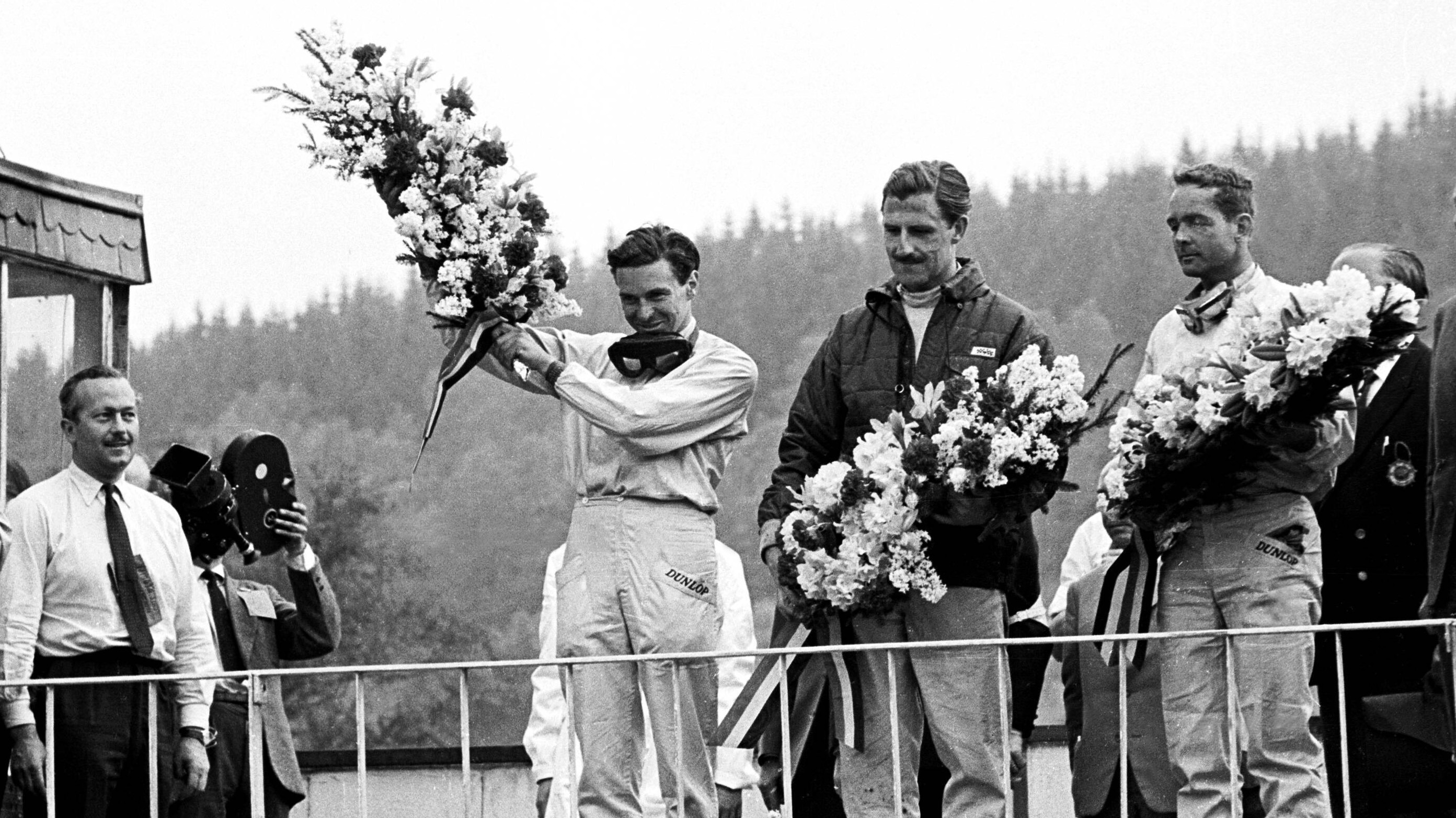 Colin Chapman looks on as Clark celebrates his first F1 victory, at the 1962 Belgium Grand Prix. Hill finished second, with Ferrari’s Phill Hill completing the podium.