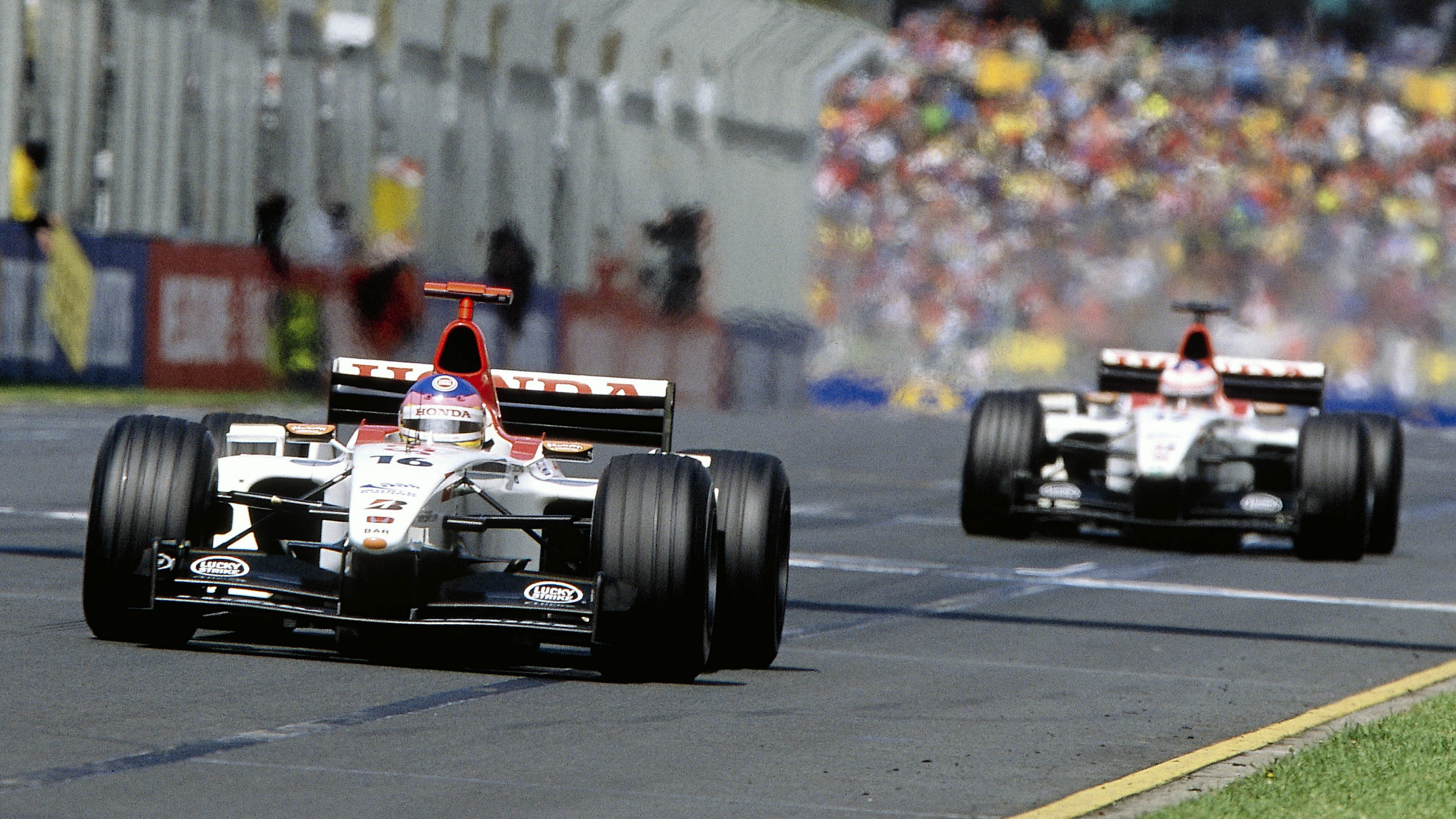 Villeneuve leads Button at the Australian Grand Prix, March 2003. The pair finished ninth and tenth respectively. 