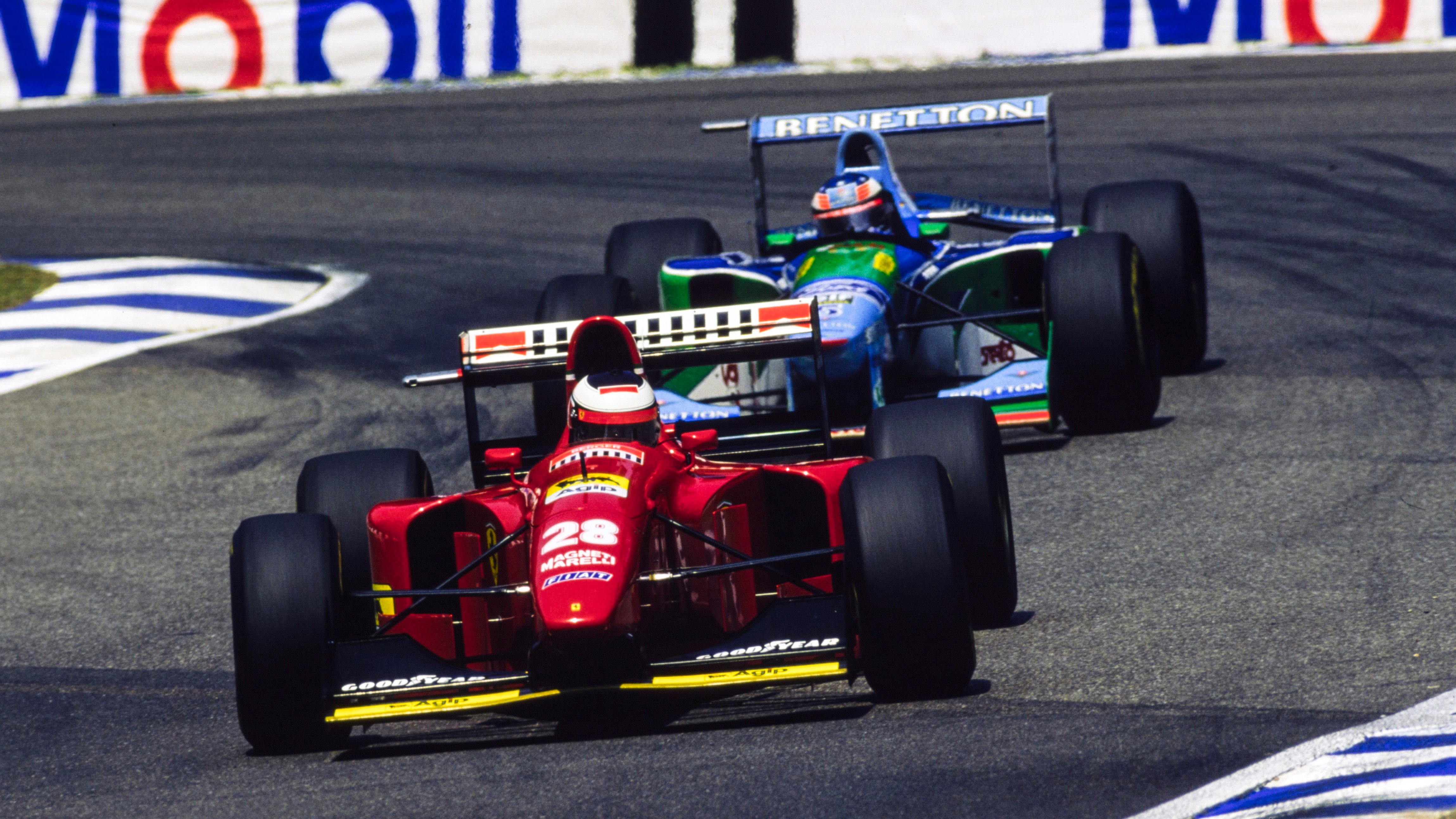 The Ferrari 412T1B of Berger leads Michael Schumacher’s Benetton B194 during the German Grand Prix at Hockenheim, July 1994.