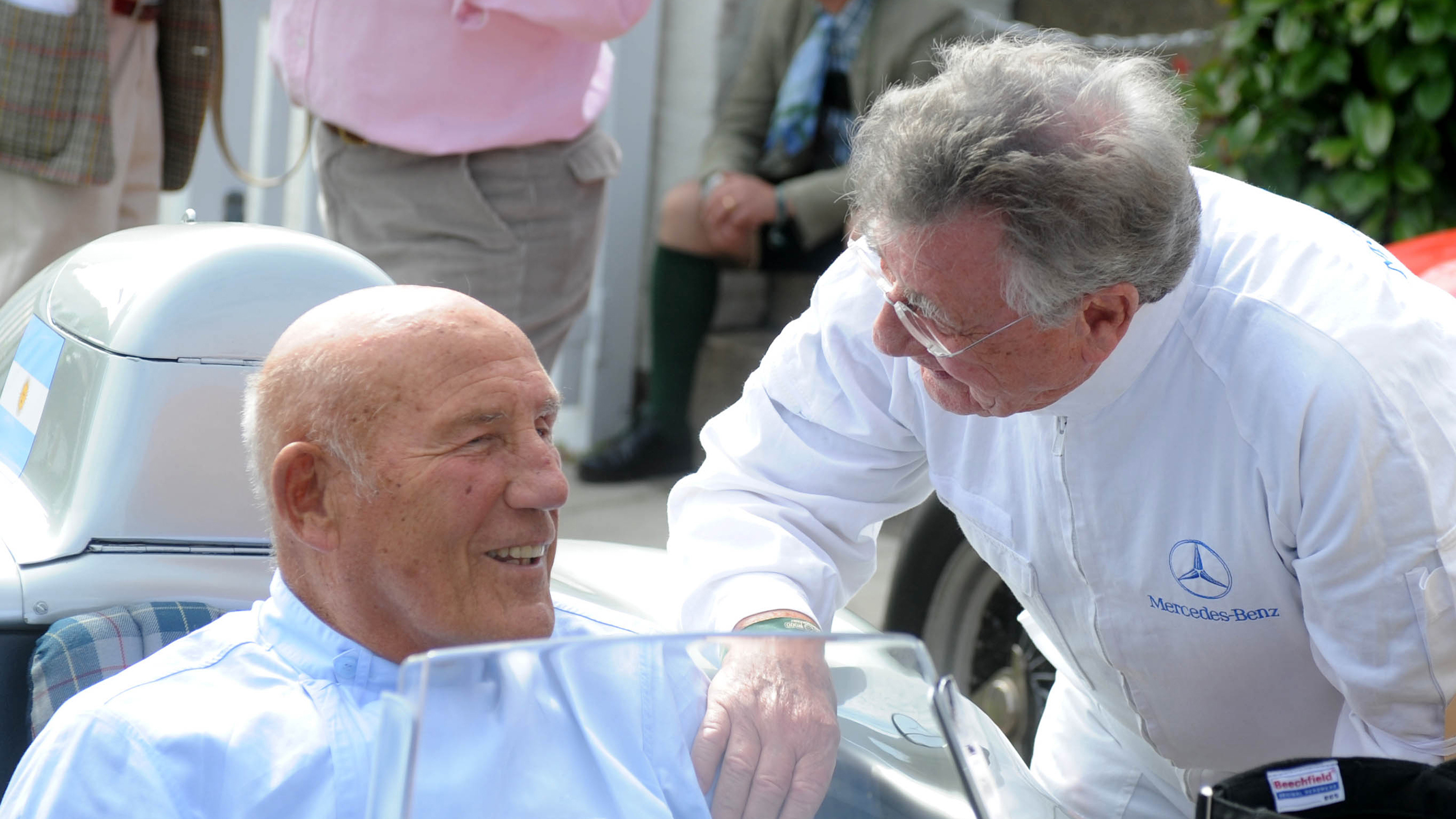 Hans Herrmann speaks to Sir Stirling Moss at the 2011 Goodwood Revival.