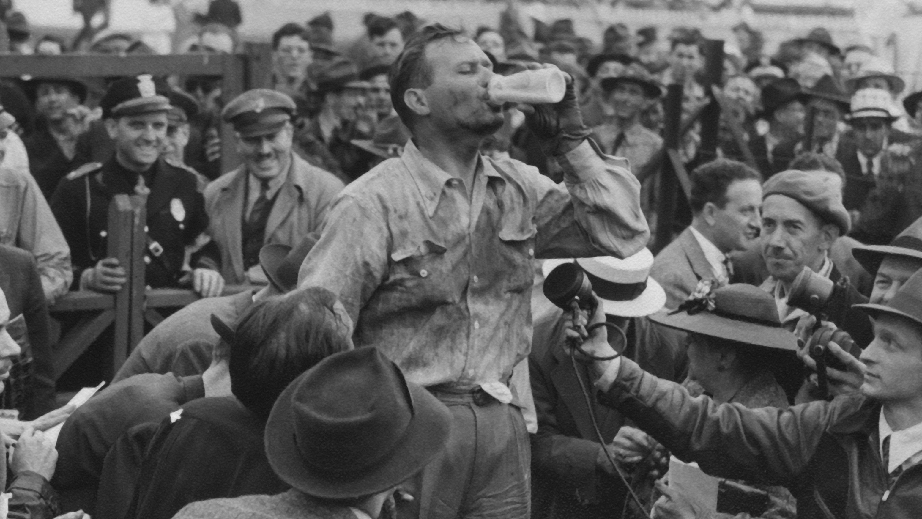 Wilbur Shaw celebrates after winning the 1940 Indy 500, the first driver to achieve back-to-back victories at the Brickyard. 