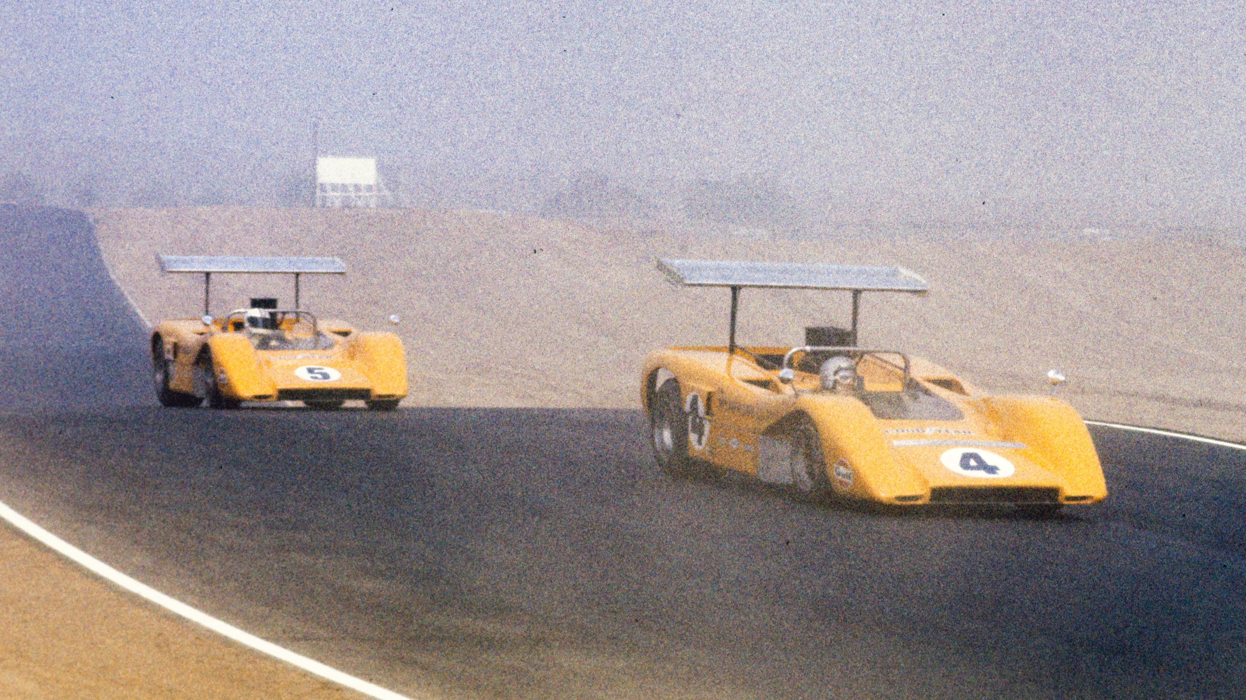 A familiar sight. The McLaren M8B Chevrolets of Bruce McLaren and Denny Hulme lead at Riverside in October 1969.
