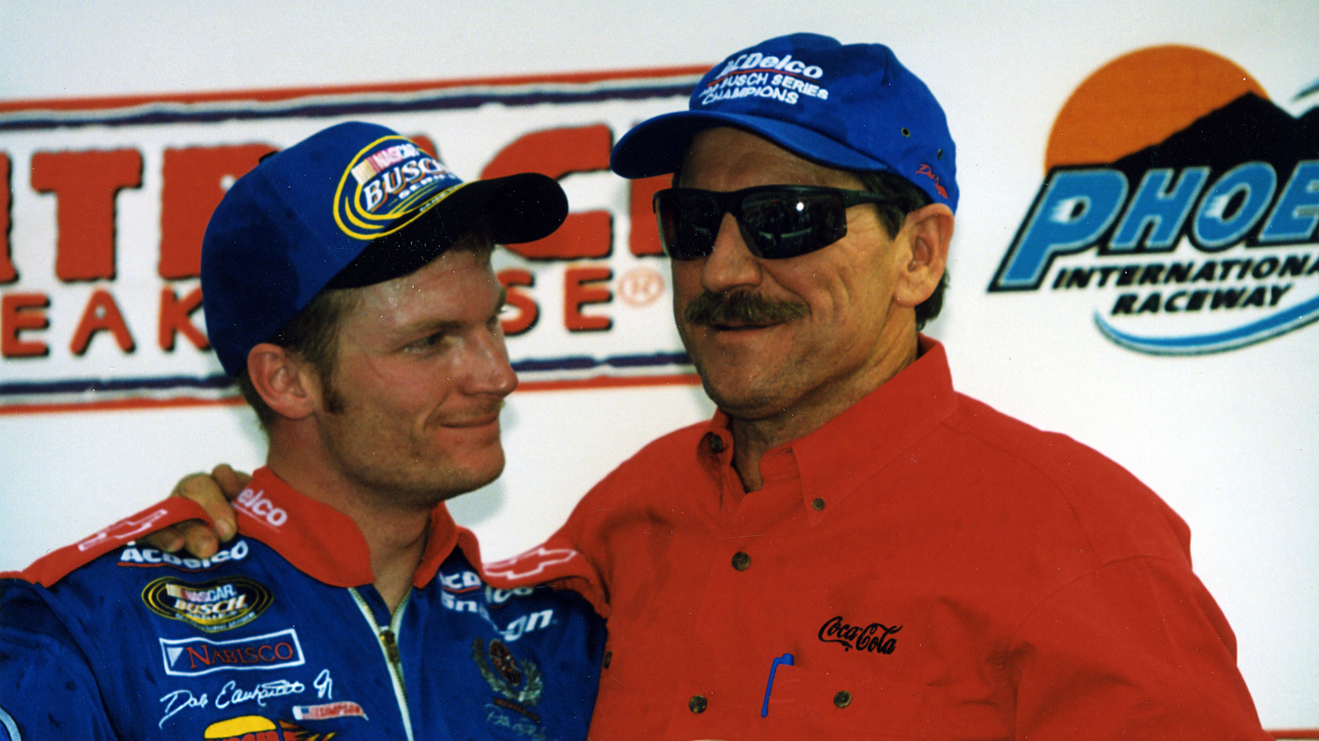 Dale Earnhardt Jr. celebrates winning the 1999 NASCAR Busch Grand National Series championship with his father. 