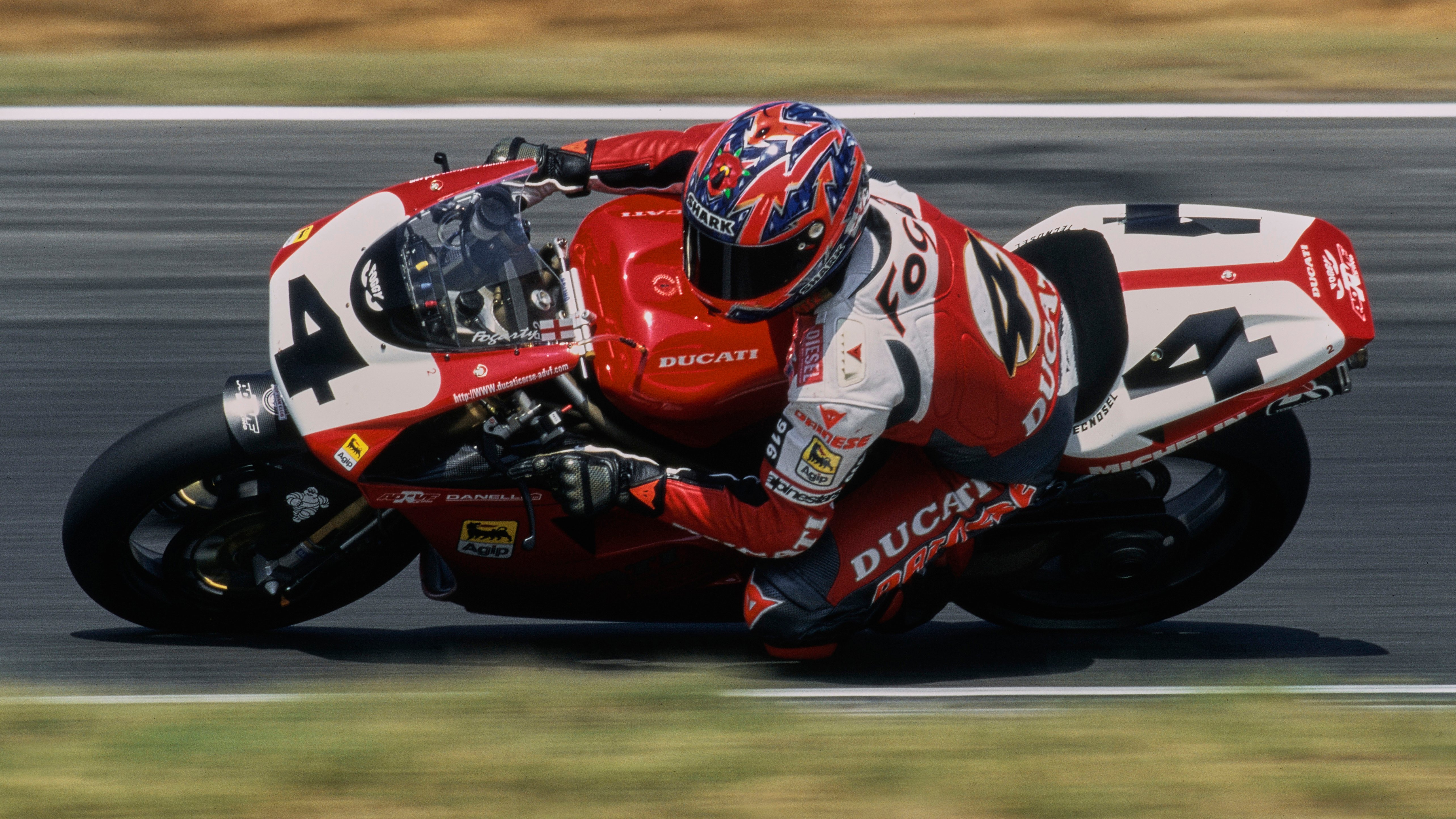 Carl Fogarty rides a Ducati 916 R at the Hockenheimring in the 1997 FIM Superbike World Championship.