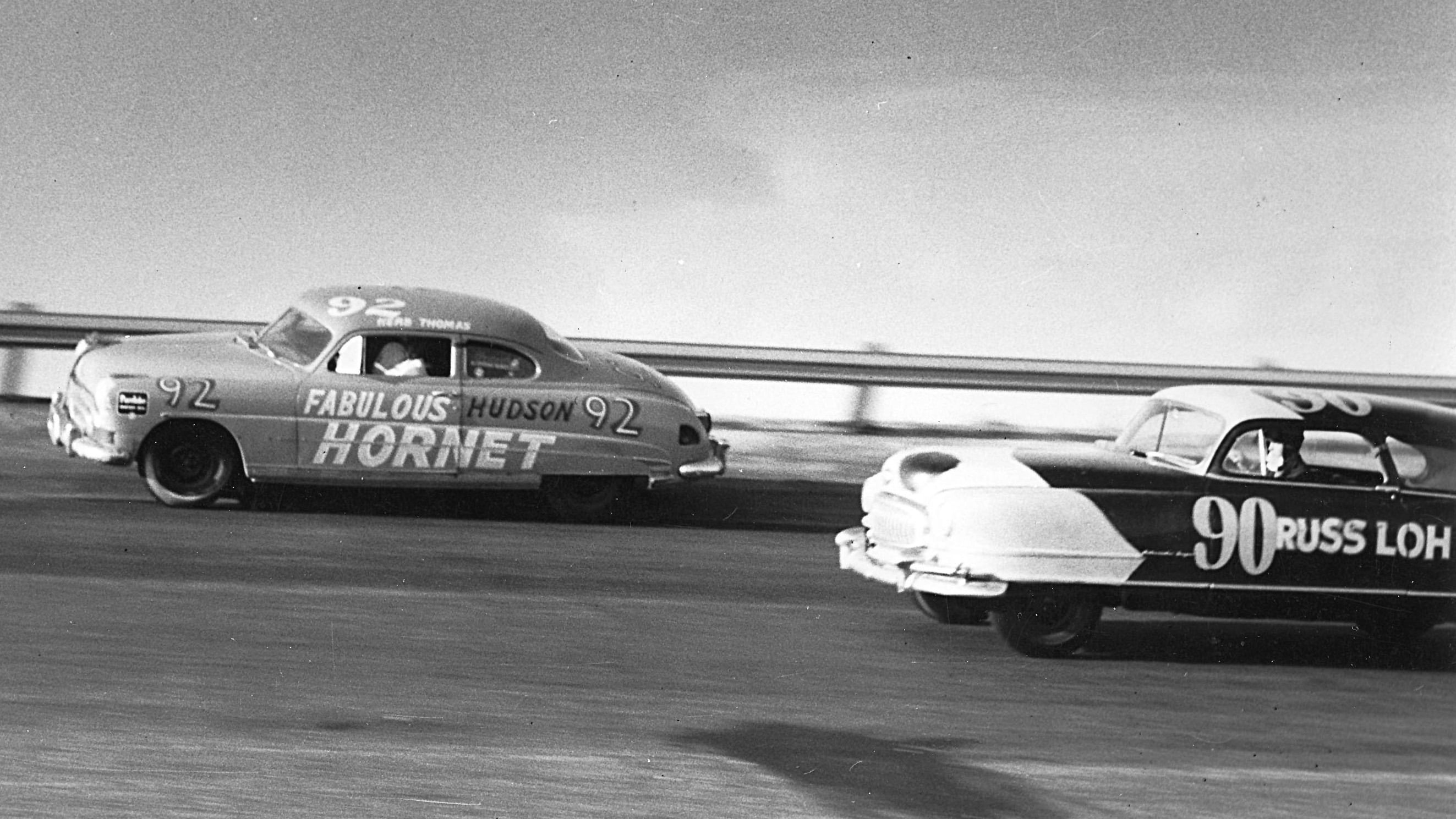 Thomas races his Hudson Hornet to victory at the Southern 500 NASCAR Cup at Darlington Raceway, September 1951.
