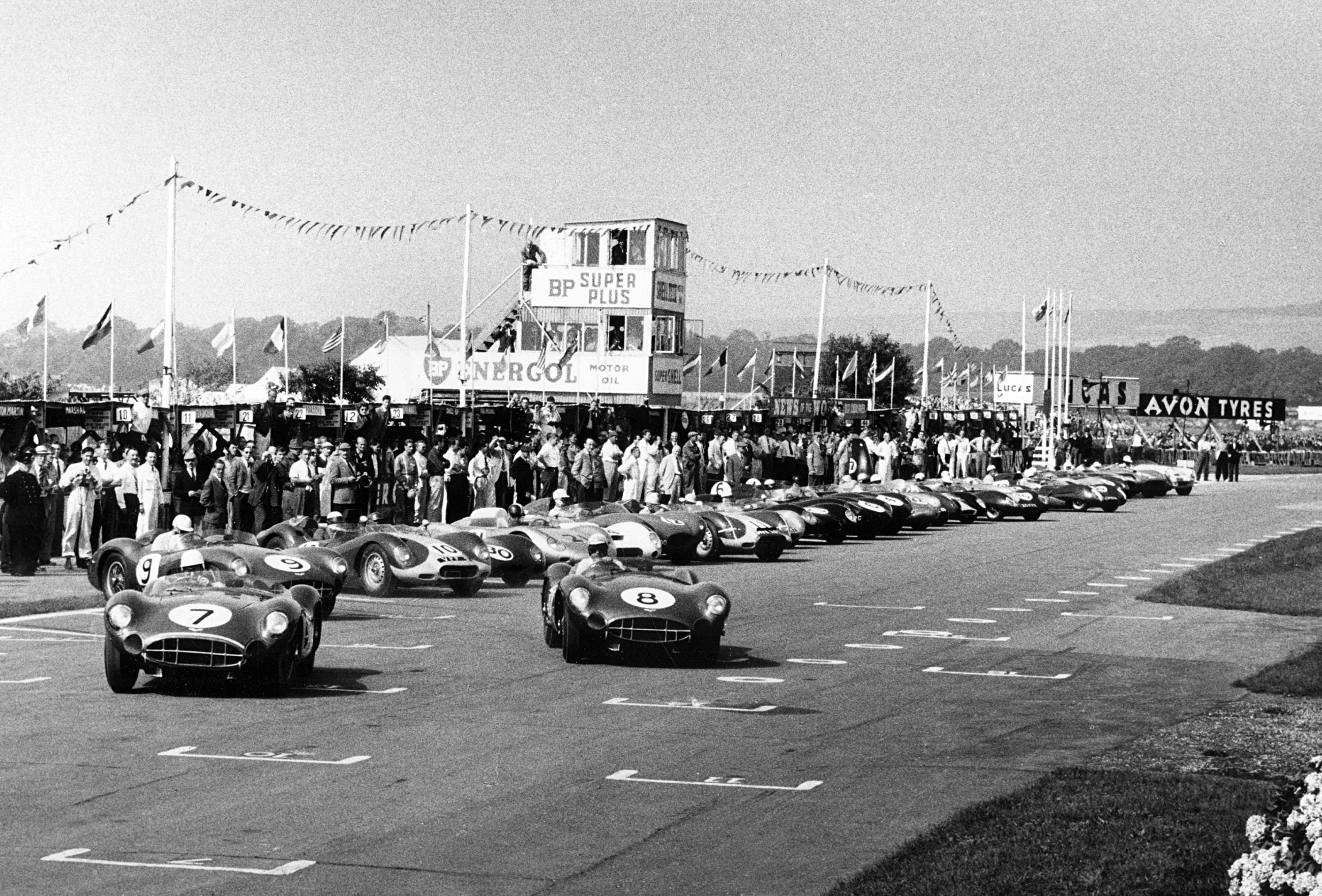 The start of the RAC Tourist Trophy race at Goodwood in 1958. Stirling Moss leads the way in the Aston Martin that he and teammate Tony Brooks drove to victory, followed by the third place finishing Aston Martin of Carroll Shelby and Stuart Lewis-Evans