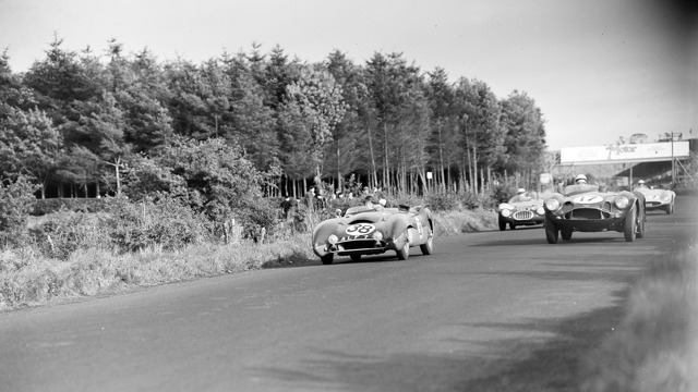 The #17 Aston Martin DB3S of Reg Parnell / Roy Salvadori battles with the John Coombs / Ian Burgess Lotus #38 Mark VIII Connaught during the 1955 RAC Tourist Trophy.