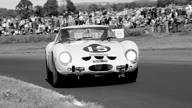 Innes Ireland on his way to victory in the #15 Ferrari GTO during the RAC Tourist Trophy at Goodwood on 18th August 1962