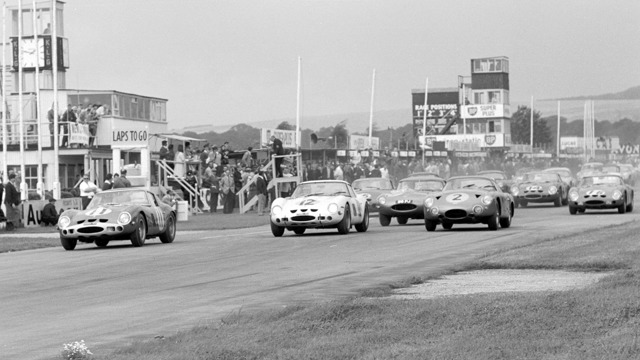 Graham Hill leads away from the start in the #11 Ferrari 250 GTO in the RAC Tourist Trophy at Goodwood in 1963 