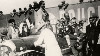 Davis (centre) and Benjafield (holding the flowers) celebrate after emerging victorious from an eventful race.
