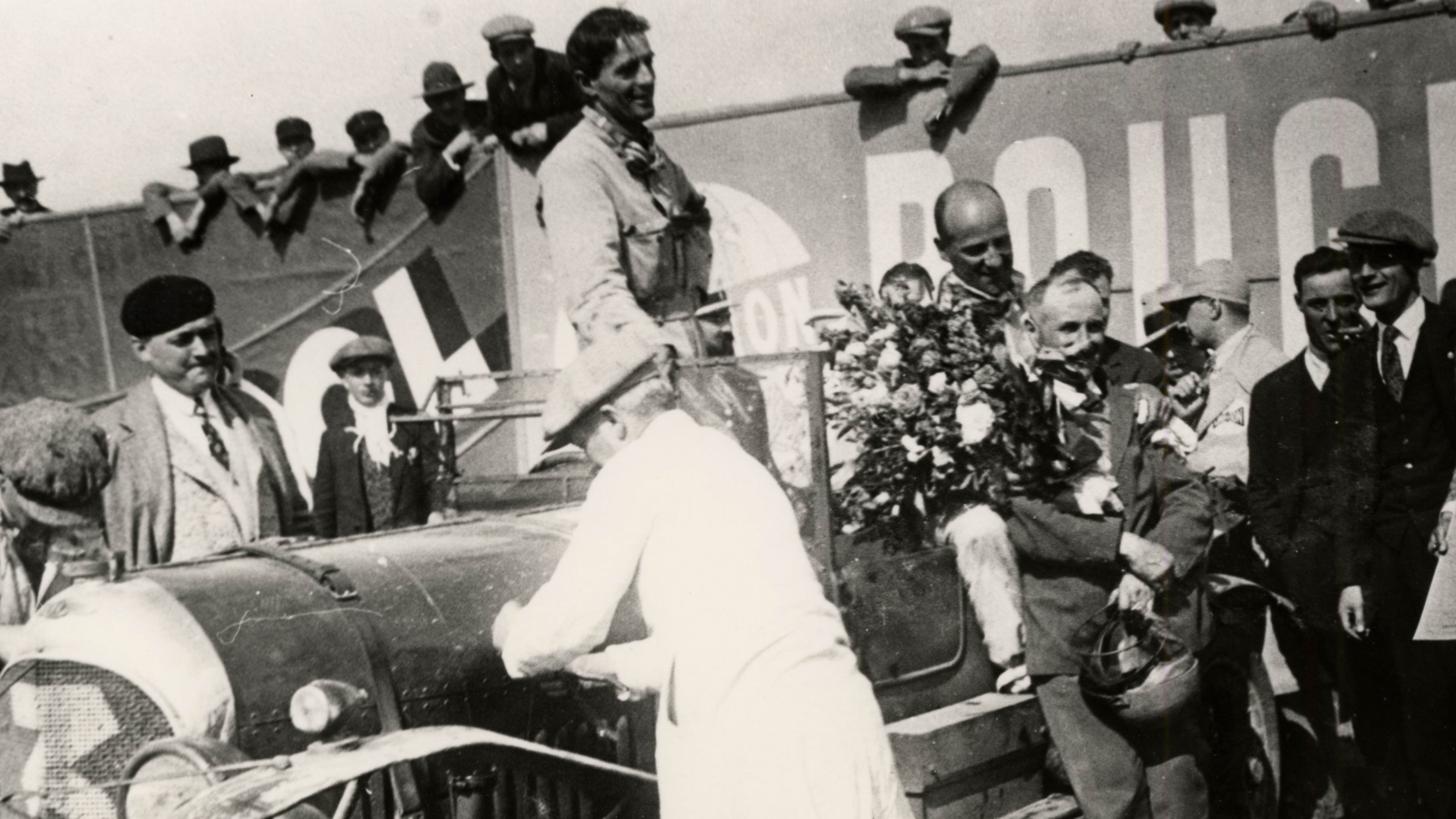 Davis (centre) and Benjafield (holding the flowers) celebrate after emerging victorious from an eventful race.