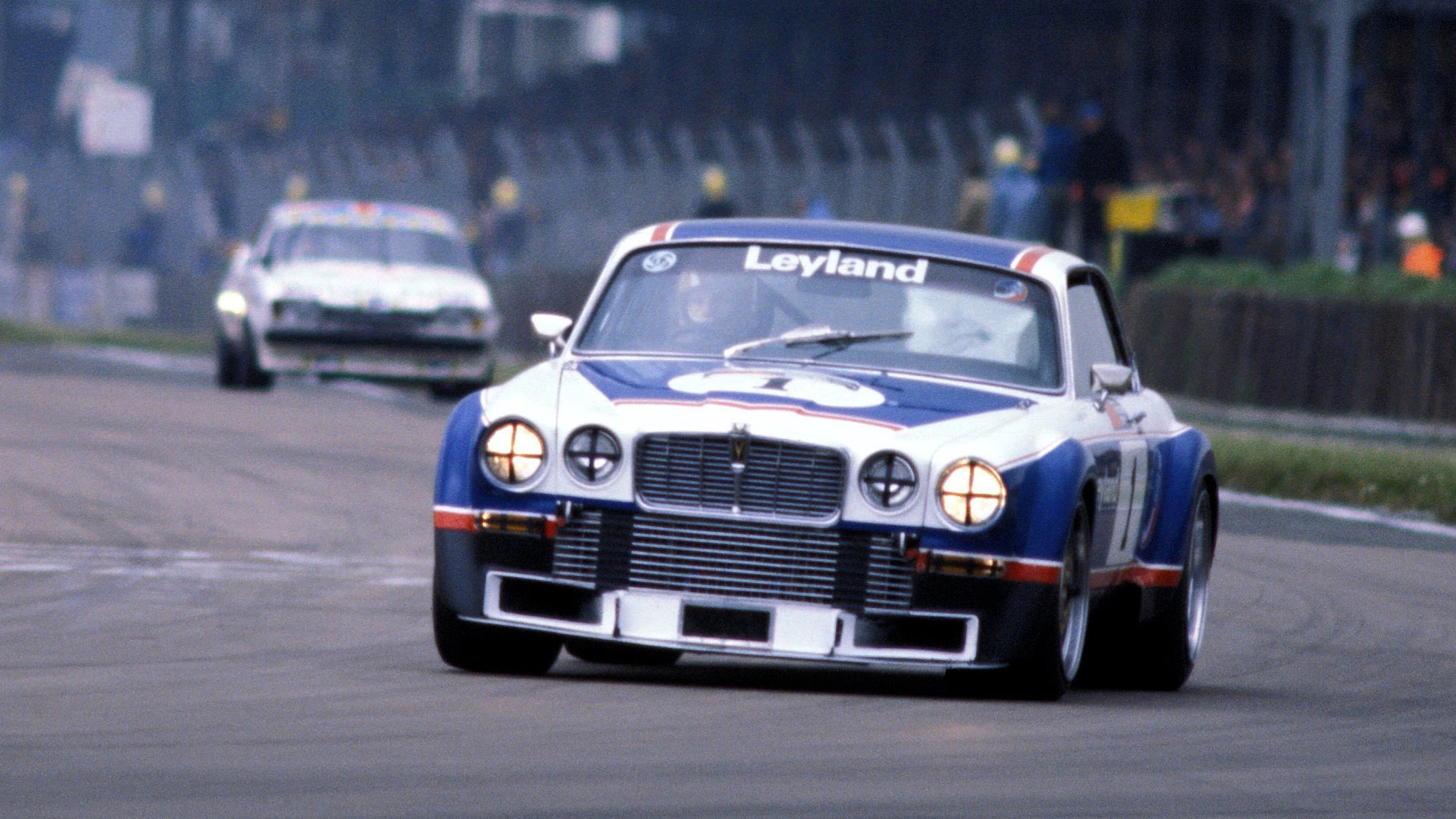 The Broadspeed Jaguar XJ12 leads at Silverstone during the 1977 European Touring Car Championship.