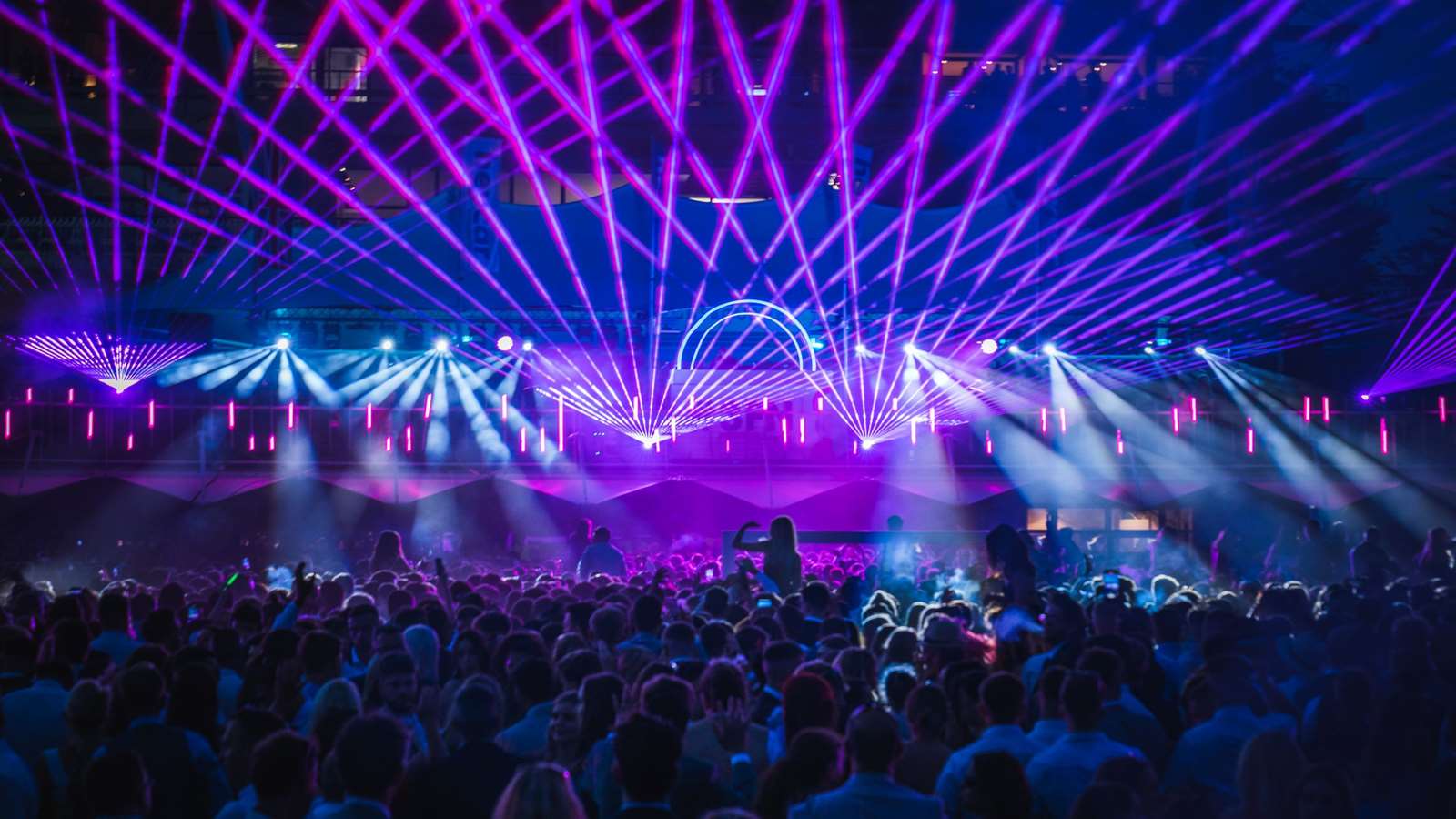 Pink and purple lasers illuminate the stage at Goodwood's Three Friday Nights events.