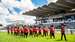 A marching band walks the course at the Qatar Goodwood Festival