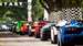 A picture of supercars at the start line before taking to the hill climb at Goodwood Festival of Speed