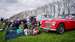 Photo of cars parked on grass bank with picnic in front
