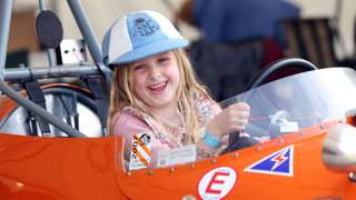 A budding driver gets behind the wheel at the 80th Members' Meeting. Ph. by PA.