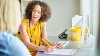 Gp practitioner talking to patient