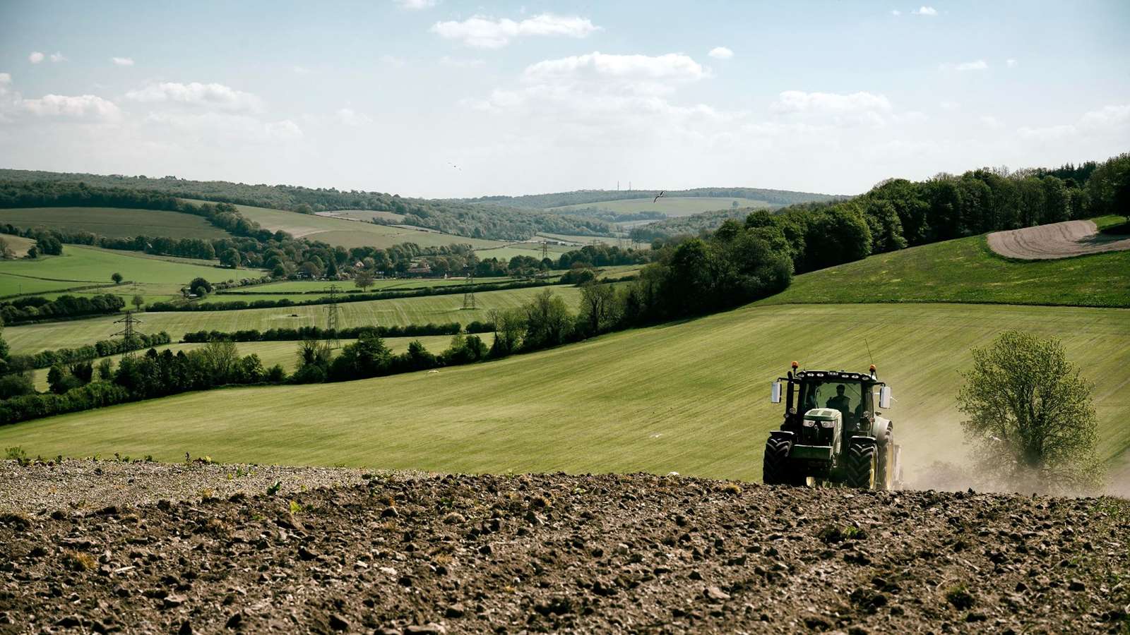 A tractor in one of the surrounding fields of the Goodwood Estate.